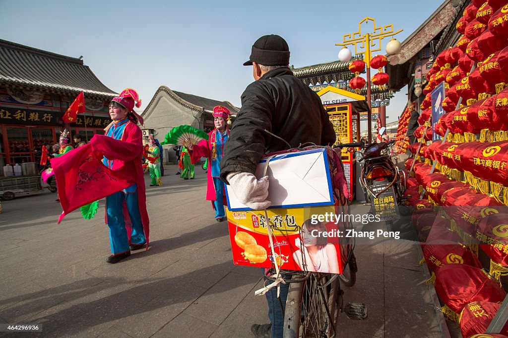 A villager is watching Yangko dance in spring festival...