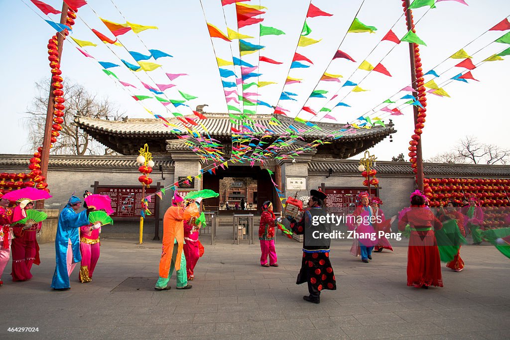 Local villagers are dancing yangko in spring festival temple...