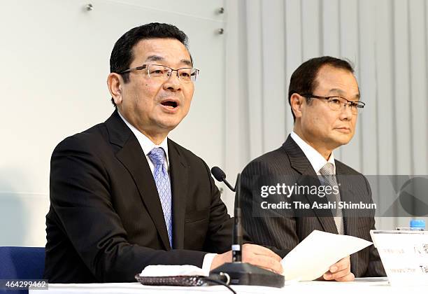 Honda Motor Co incoming president Takahiro Hachigo speaks while outgoing president Takanobu Ito listens during a press conference at the headquarters...