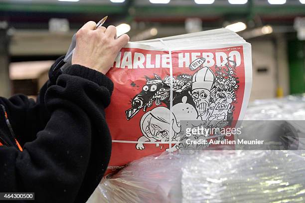 French satirical weekly Charlie Hebdo's second edition since the terrorist attack on the magazine in January, is prepared at a press distribution...