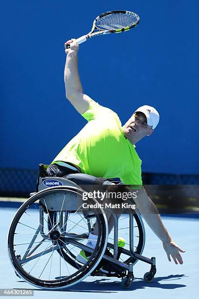 Adam Kellerman of Australia plays a backhand in his quarterfinal wheelchair singles match against Maikel Scheffers of the Netherlands during the 2014...