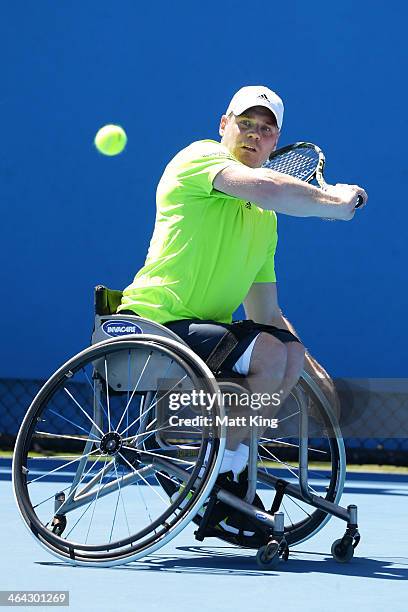 Adam Kellerman of Australia plays a backhand in his quarterfinal wheelchair singles match against Maikel Scheffers of the Netherlands during the 2014...