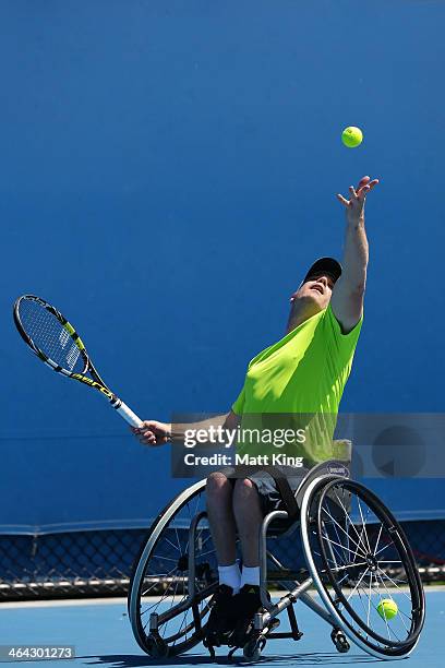 Adam Kellerman of Australia serves in his quarterfinal wheelchair singles match against Maikel Scheffers of the Netherlands during the 2014...