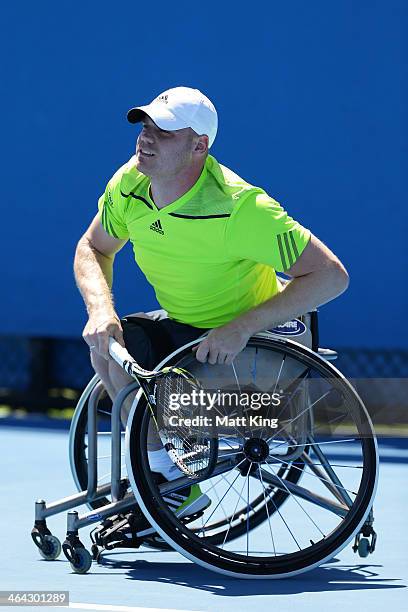 Adam Kellerman of Australia plays a forehand in his quarterfinal wheelchair singles match against Maikel Scheffers of the Netherlands during the 2014...