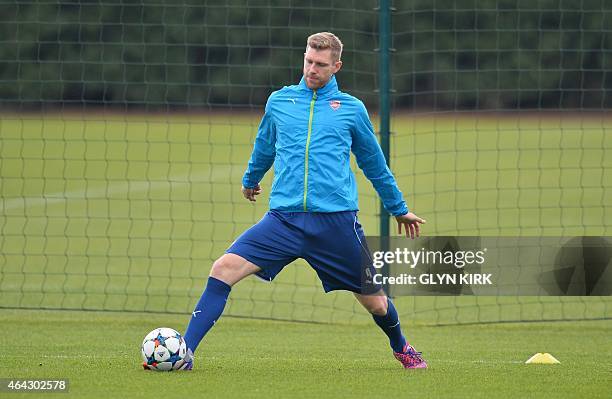 Arsenal's German defender Per Mertesacker attends a training session at Arsenal's training ground in London Colney, north of London, England on...