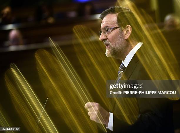 Spanish Prime Minister Mariano Rajoy speaks during a debate on the state of the nation at the Congress of Deputies building in Madrid on February 24,...