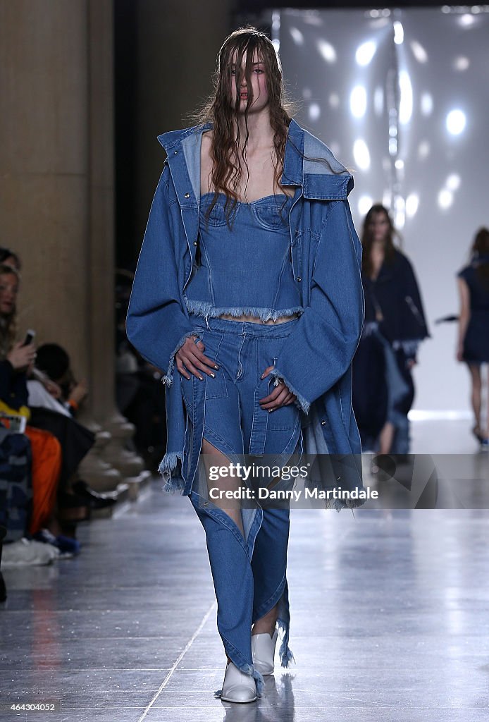 A model walks the runway at the Marques'Almeida show during London ...