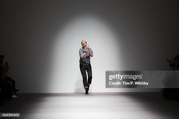 Christopher Raeburn appears at the end of his show during London Fashion Week Fall/Winter 2015/16 at Somerset House on February 24, 2015 in London,...