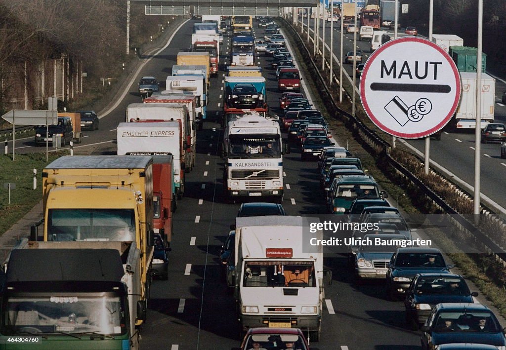 Shield Toll And Highway Traffic (Photomontage).