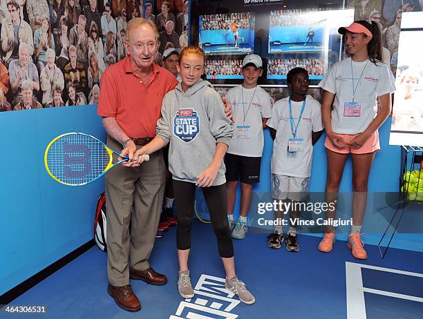 Rod Laver giving granddaughter Renae some tips at Grand Slam oval during day 9 of the 2014 Australian Open at Melbourne Park on January 21, 2014 in...