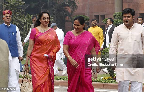 MPs Hema Malini, Dushyant Singh and others coming out after BJP Parliamentary party meeting at Parliament house on February 24, 2015 in New Delhi,...