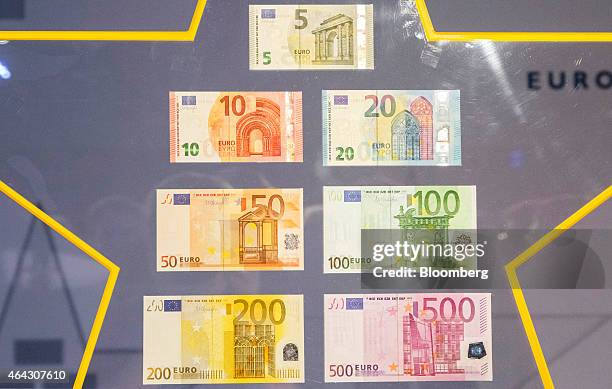 Various denominations of euro banknotes sits on display at the European Central Bank headquarters in Frankfurt, Germany, on Tuesday, Feb. 24, 2015....