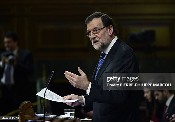 Spanish Prime Minister Mariano Rajoy speaks during a debate on the state of the nation at the Congress of Deputies building in Madrid on February 24,...