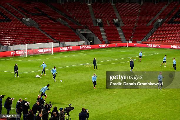Atletico Madrid players practice during a press conference ahead of their UEFA Champions League Round of 16 first leg match against Bayer Leverkusen...