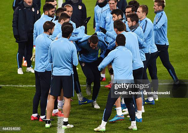Atletico Madrid players practice during a press conference ahead of their UEFA Champions League Round of 16 first leg match against Bayer Leverkusen...