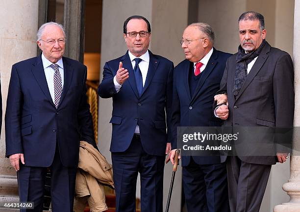 Paris Mosque rector Dalil Boubakeur and French Jewish Institutions Representative Council President Roger Cukierman are escorted by French President...