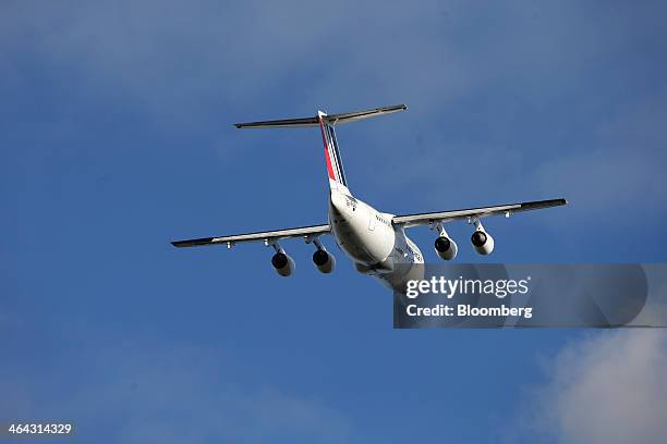 An Avro RJ85 passenger aircraft, operated by CityJet Ltd., a unit of Air France-KLM Group, flies near London City Airport in London, U.K., on...