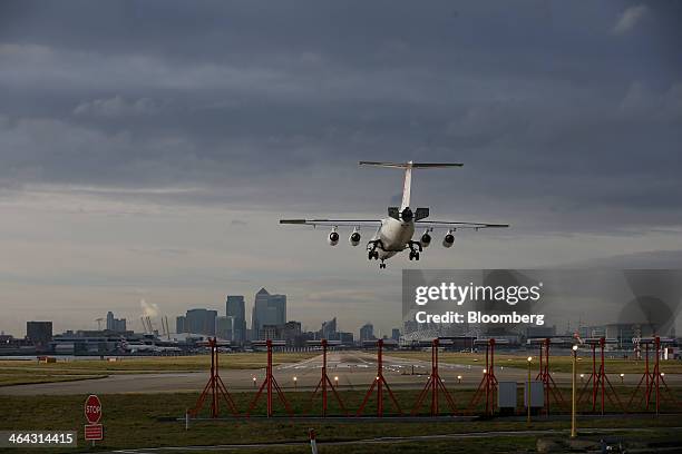 An Avro RJ85 passenger aircraft, operated by CityJet Ltd., a unit of Air France-KLM Group, comes in to land on a runway at London City Airport in...