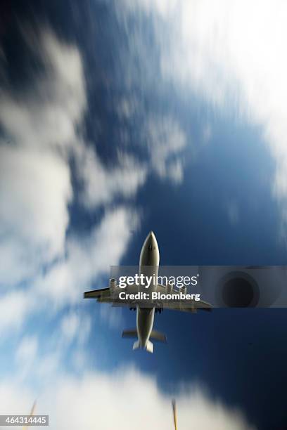 Passenger aircraft prepares to land at London City Airport in London, U.K., on Tuesday, Jan. 21, 2014. Air France-KLM Group received a firm offer for...