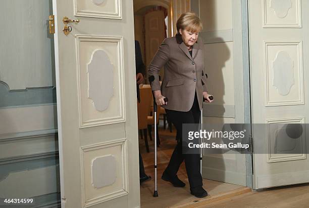 German Chancellor Angela Merkel, walking with crutches due to an injured while skiing, and Vice Chancellor and Economy and Energy Minister Sigmar...