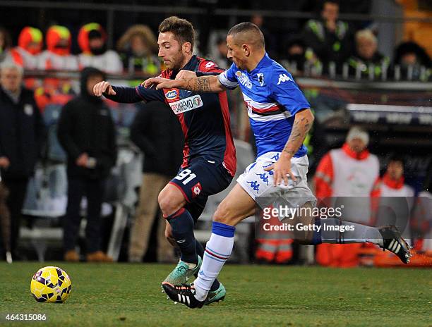 Andrea Bertolacci of Genoa CFC is challenged by Angelo Palombo of UC Sampdoria during the Serie A match between UC Sampdoria and Genoa CFC at Stadio...