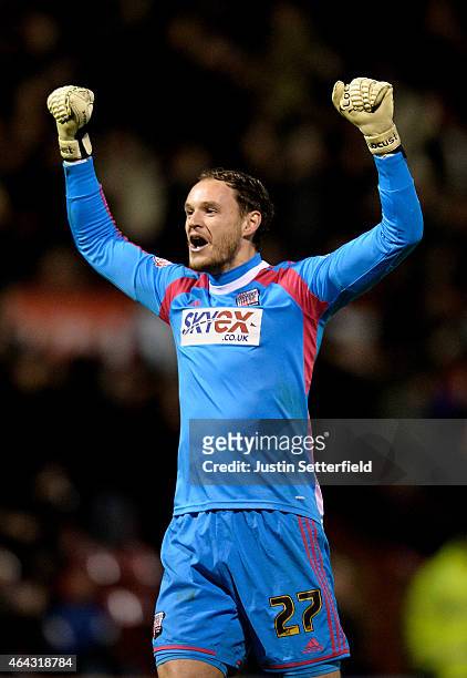 Goalkeeper David Button of Brentford celebrates as his team score the opening goal during the Sky Bet Championship match between Brentford and...