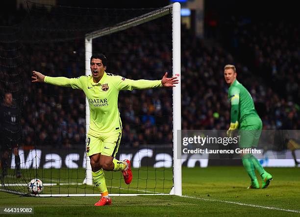 Luis Suarez of Barcelona celebrates scoring their second goal during the UEFA Champions League Round of 16 match between Manchester City and...