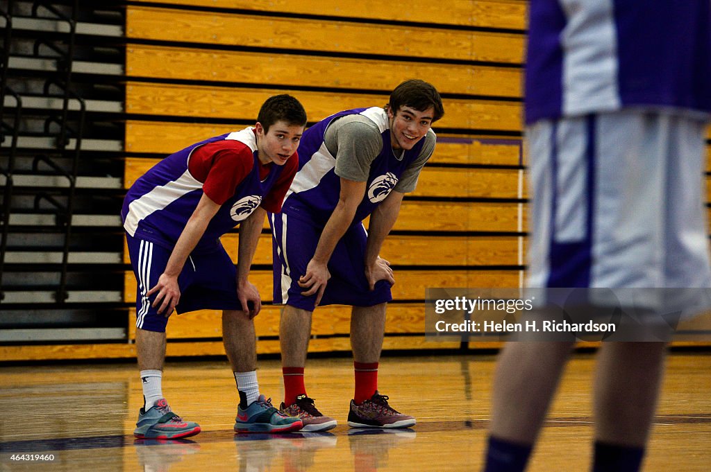 Brothers Thomas and Luke Neff practice at Arvada West high school in Arvada, Colorado.