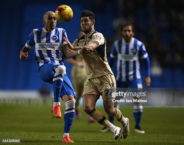 Alex Mowatt of Leeds tries to tackle Bruno Saltor of Brighton & Hove during the Sky Bet Championship match between Brighton & Hove Albion and Leeds...