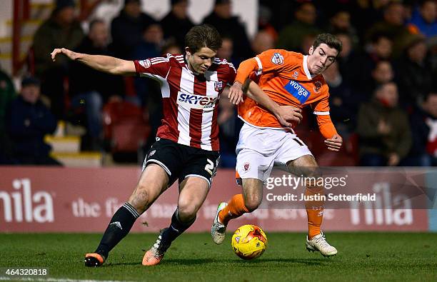 James Tarkowski of Brentford FC and Joe Rothwell of Blackpool during the Sky Bet Championship match between Brentford and Blackpool at Griffin Park...