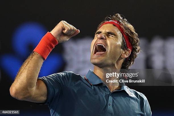 Roger Federer of Switzerland celebrates winning his quarterfinal match against Andy Murray of Great Britain during day 10 of the 2014 Australian Open...