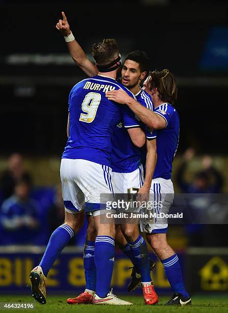Kevin Bru of Ipswich Town celebrates with Daryl Murphy and Jay Tabb as he scores their fourth goal during the Sky Bet Championship match between...