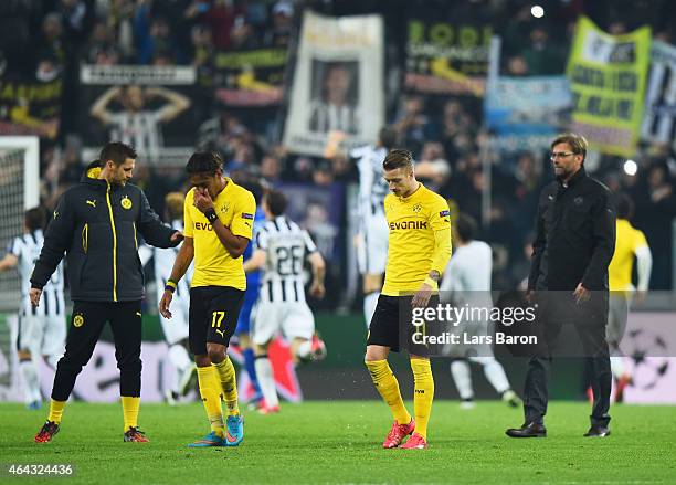 Pierre-Emerick Aubameyang , Marco Reus and Jurgen Klopp manager of Borussia Dortmund look dejected after defeat during the UEFA Champions League...