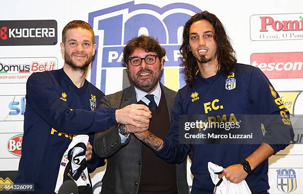 Jonathan Rossini, General Manager for Parma FC Pietro Leonardi and Ezequiel Schelotto are presented as new signings for Parma FC during a press...