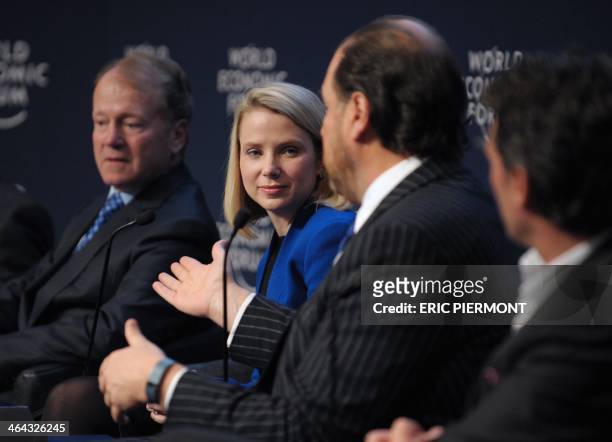 Marc Benioff of the United States, Chairman and CEO of Salesforce.com, talks as Yahoo CEO Marissa Mayer during the "new digital context" session at...