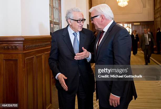 Arab League envoy for Syria Lakhdar Brahimi and German Foreign Minister Frank-Walter Steinmeier talk to each other at Geneva II Syria Peace...