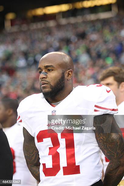 Donte Whitner of the San Francisco 49ers stands on the sideline prior to the game against the Seattle Seahawks at CenturyLink Field on January 19,...