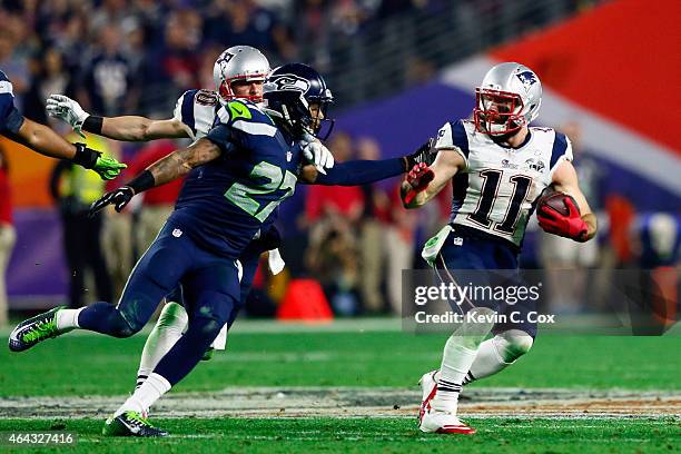 Wide receiver Julian Edelman of the New England Patriots in action against cornerback Tharold Simon of the Seattle Seahawks during Super Bowl XLIX at...
