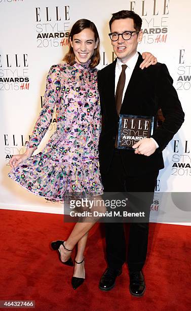 Alexa Chung and Erdem Moralioglu, winner of the Designer of the Year award, pose in the Winners Room at the Elle Style Awards 2015 at Sky Garden @...