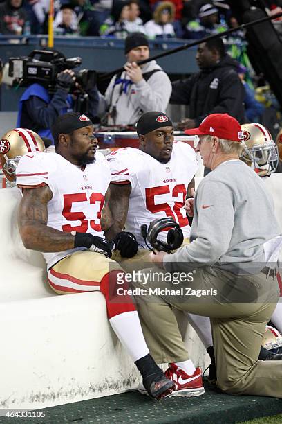 Linebackers Coach Jim Leavitt of the San Francisco 49ers talks with NaVorro Bowman and Patrick Willis during the game against the Seattle Seahawks at...