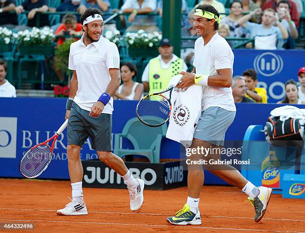 Juan Monaco of Argentina and Rafael Nadal of Spain smile during a doubles match between Frantisek Cermak and Jiri Vesely of Czech Republic and Juan...