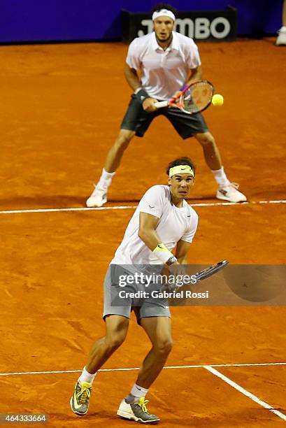 Rafael Nadal of Spain looks the ball during a doubles match between Frantisek Cermak and Jiri Vesely of Czech Republic and Juan Monaco of Argentina...