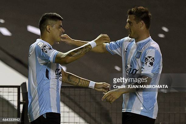 Argentina's Racing Club forward Gustavo Bou celebrates with teammate defender Ivan Pillud after scoring the team's first goal against Paraguay's...