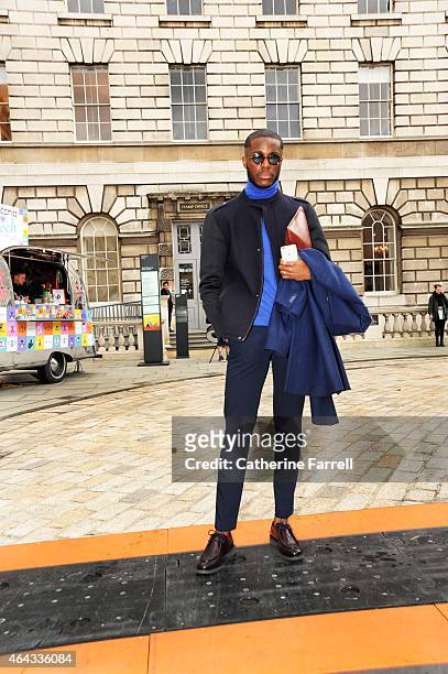 Simon Njondgock, fashion business student from Paris wearing a Benetton jacket, sweater and trousers, accessorised with fashion spectacles during...
