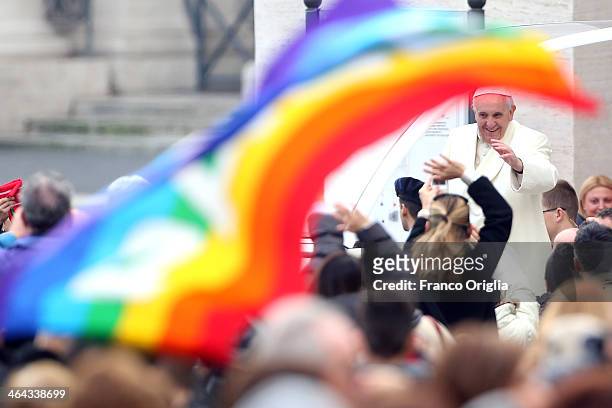 Pope Francis waves to the crowds as he arrives in St. Peter's square for his weekly audience on January 22, 2014 in Vatican City, Vatican. Pope...