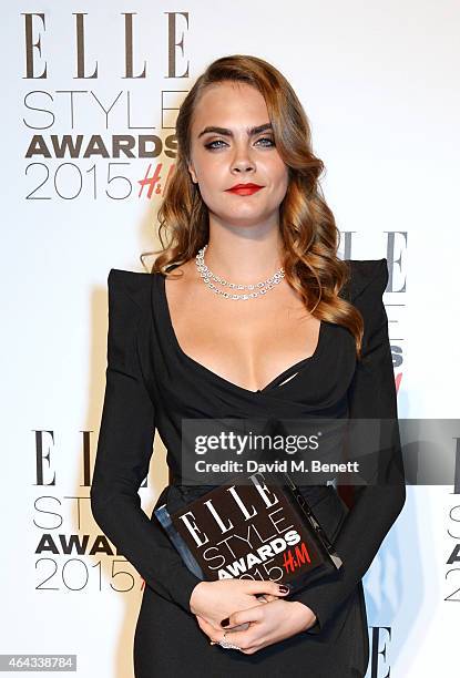 Cara Delevingne, winner of the Breakthrough Actress award, poses in the Winners Room at the Elle Style Awards 2015 at Sky Garden @ The Walkie Talkie...