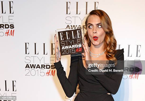 Cara Delevingne, winner of the Breakthrough Actress award, poses in the Winners Room at the Elle Style Awards 2015 at Sky Garden @ The Walkie Talkie...