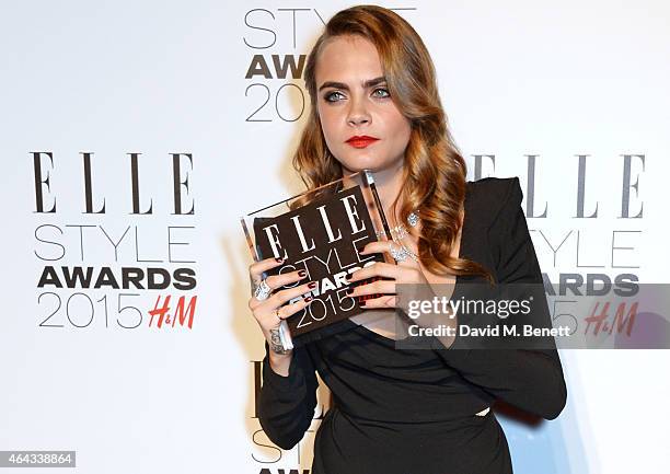 Cara Delevingne, winner of the Breakthrough Actress award, poses in the Winners Room at the Elle Style Awards 2015 at Sky Garden @ The Walkie Talkie...