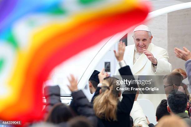Pope Francis waves to the crowds as he arrives in St. Peter's square for his weekly audience on January 22, 2014 in Vatican City, Vatican. Pope...