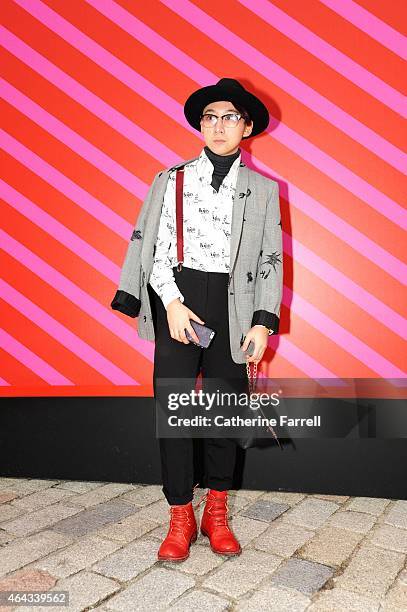 Tia Xu, fashion design student at Central Saint Martins weaing a Commes des Garcon jacket,and a Commes des Garcon shirt, trousers designed by Tia...